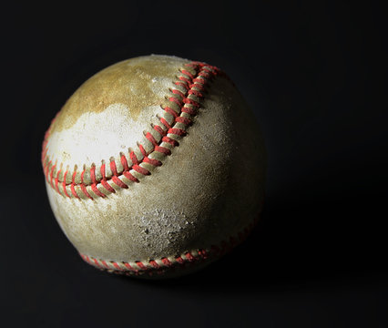 Old vintage baseball on black background