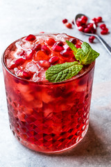 Pomegranate Cocktail with Mint Leaves and Crushed Ice.