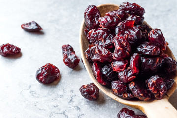 Dried Blueberries in Wooden Spoon.
