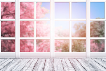 Fototapety  Wnętrze pokoju z ramą okienną i drewnianym stołem w stylu Shabby Chic. Wiosenny słoneczny dzień z różowymi drzewami sakura na zewnątrz.