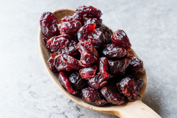Dried Blueberries in Wooden Spoon.
