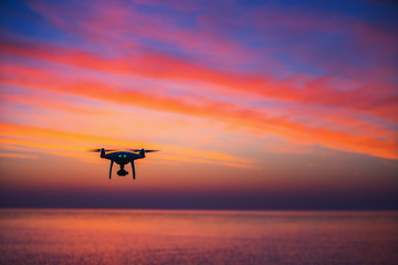 Fototapeta na wymiar Flying dron over the sea