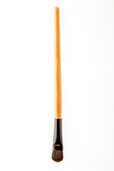 cosmetic makeup brush on white blackground close up