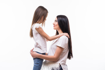 Closeup portrait of mother and daughter hugging in white background