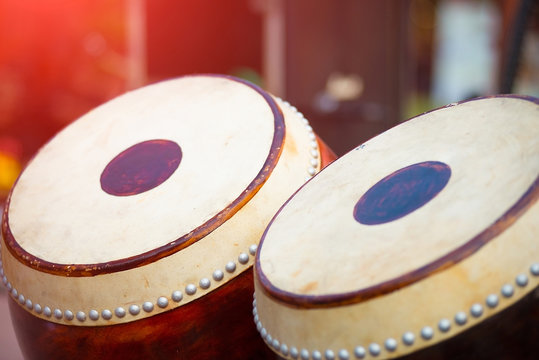 A drum composed of skins and logs is a musical instrument.