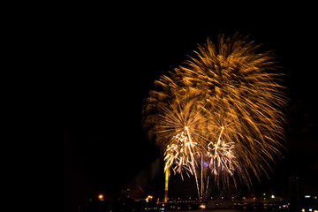 Beautiful golden firework display for celebration happy new year and merry christmas in the night sky, bangkok city, thailand