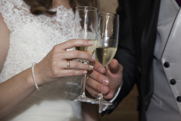 detail of the toast of the hands of a newly-married couple