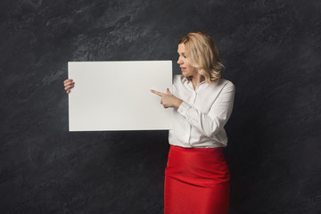 Businesswoman with blank white paper