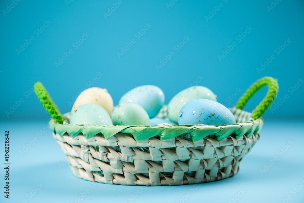 Wall mural Easter eggs on blue background