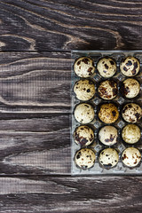 For sale quail eggs in a transparent tray, a tray for storing quail eggs, a symbol for the Easter season. Healthy eating.