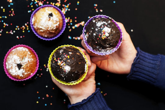 The young girl was preparing home-made mafines with chocolate