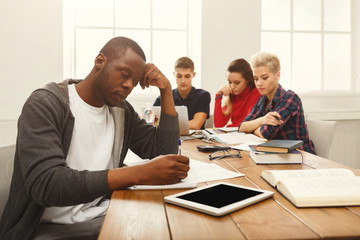 Black man using laptop at modern office