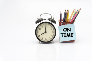 ON TIME concept, clock and colour pencil