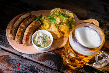 Assorted beer snacks with beer mug