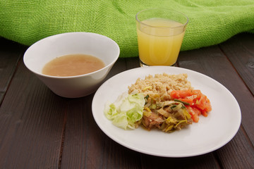 Wheat gluten on leek with couscous on a table