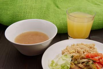 Wheat gluten on leek with couscous on a table