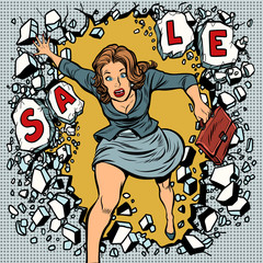 A woman runs for sales, breaking the wall