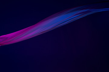 Smooth elegant transparent blue cloth separated on blue background.