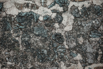 Old wall made of natural stone texture background