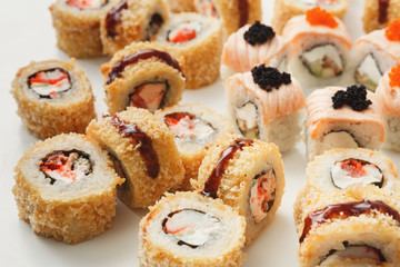 Closeup of sushi rolls on white background