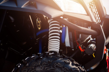 Atv Quad bike, close-up of details: headlights, shock absorber. © Parilov