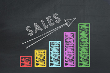 Colored business chart with arrow showing growth of sales rate
