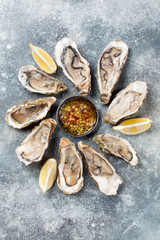 Fresh oysters on stone table