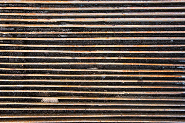 Rusty metal mesh made of horizontal stripes