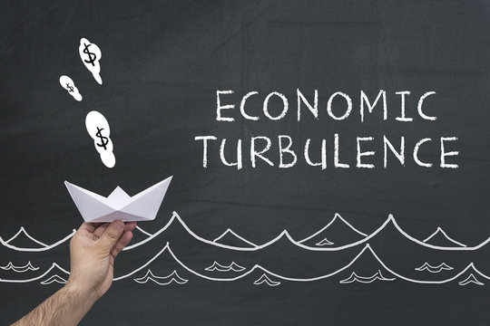 Economic Turbulence Concept On Chalkboard