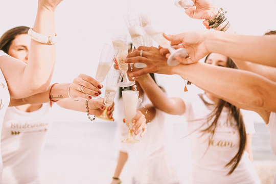Women pouring champagne outdoors