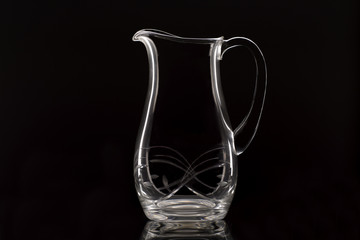 pitcher of water on black background