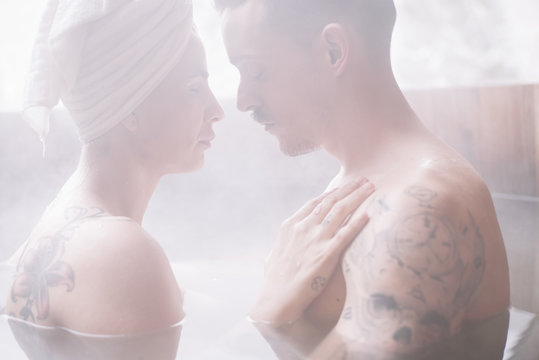Sensual couple in plunge tub