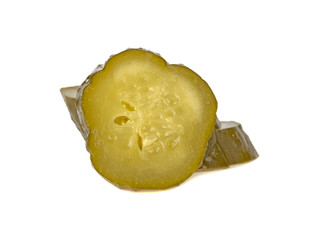 pickled cucumber cut into slices on a white background
