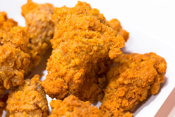 chicken fried isolated on white background, front view from the top, technical cost-up.