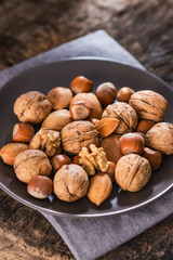 Mixed Nuts on Rustic Wooden Table