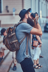 Fototapeta premium A handsome hipster male with a stylish beard and tattoo on his a