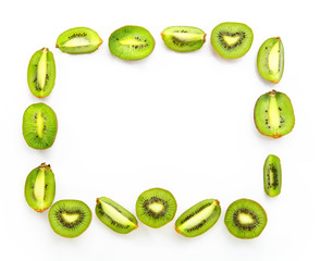 Rectangular frame of halves of kiwi on white background. Space for text inside. Ripe fresh kiwi fruit.