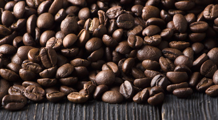 roasted coffee beans on wood texture