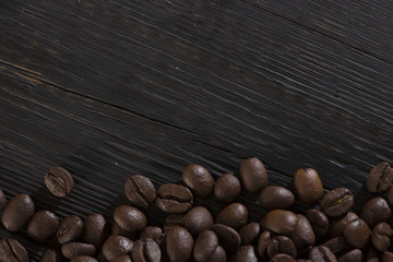 roasted coffee beans on wood texture
