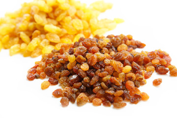 Various raisins on the white background. Dried grapes.
