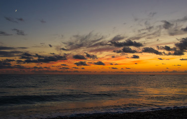 Amazing sea sunset, the sun, waves, clouds