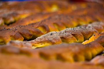 baked homemade rustic pie with apples, poppy seeds and jam