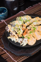 japanese cuisine. hot plate sea food on the background