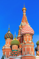 Fototapeta na wymiar Domes of St. Basil's Cathedral on a winter morning. Moscow in winter