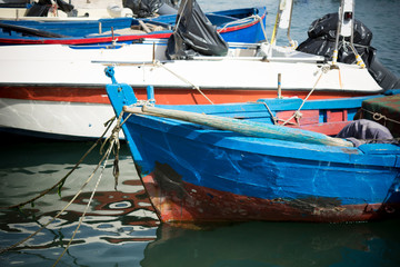 Fototapeta na wymiar Horizontal View of Boats Moored in the Bari Touristic Harbour on Partially Cloudy Sky Background. Bari, South of Italy