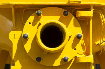 Water pump detail with hole for hose connection, part of construction machine, heavy industry 