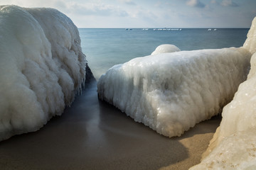 Frozen rocks on the beach by the Baltic sea in Hel, Poland