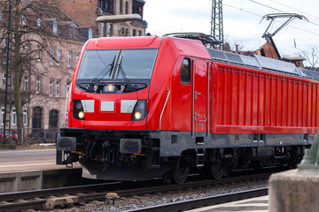 a german train passes a train station