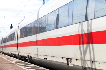 a german train passes a train station