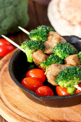 Nice meat kebab with broccoli on skewers